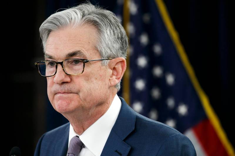 FILE - In this Tuesday, March 3, 2020 file photo, Federal Reserve Chair Jerome Powell pauses during a news conference to discuss an announcement from the Federal Open Market Committee, in Washington. Federal Reserve Chair Jerome Powell expressed optimism Sunday, May 17, 2020 that the U.S. economy can begin to recover from a devastating recession in the second half of the year, assuming the coronavirus doesn't erupt in a second wave. But he suggested that a full recovery won't likely be possible before the arrival of a vaccine.. (AP Photo/Jacquelyn Martin, File)