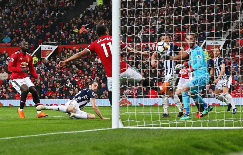epa06671485 West Bromwich's Jay Rodriguez (2-L) scores the 1-0 lead during the English Premier League soccer match between Manchester United and West Bromwich Albion at Old Trafford in Manchester, Britain, 15 April 2018.  EPA/NIGEL RODDIS EDITORIAL USE ONLY. No use with unauthorised audio, video, data, fixture lists, club/league logos 'live' services. Online in-match use limited to 75 images, no video emulation. No use in betting, games or single club/league/player publications.