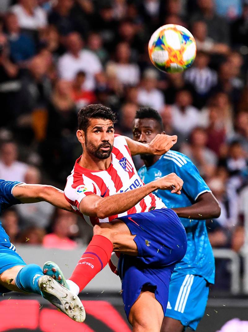 Atletico Madrid's forward Diego Costa wins a tussle. AFP