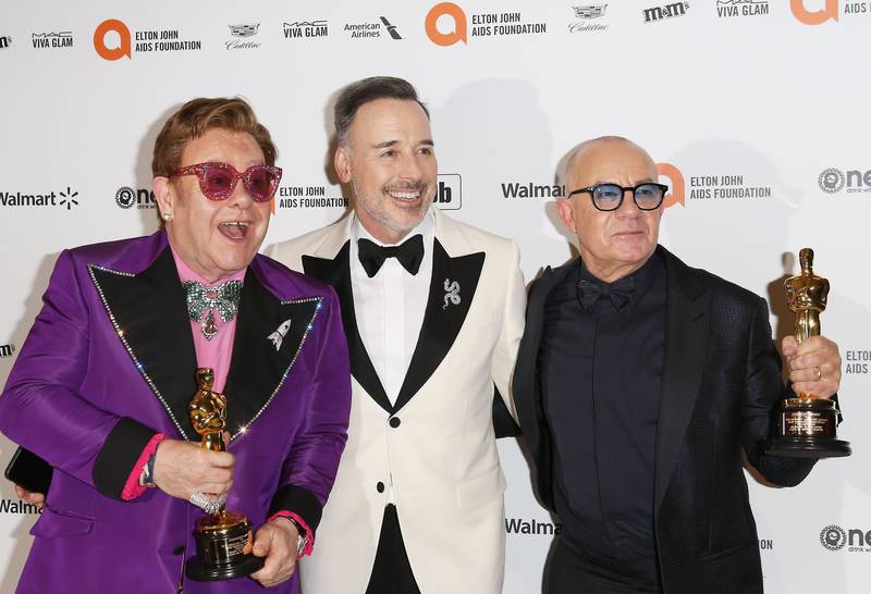 Sir Elton John, David Furnish and Bernie Taupin arrive at the 2020 Elton John Aids Foundation Oscar Viewing Party on February 9, 2020, in California. AFP