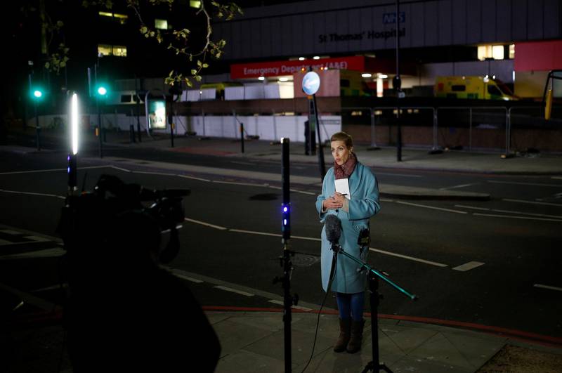 A journalist is seen outside of the St Thomas' Hospital after British Prime Minister Boris Johnson was moved to intensive care after his coronavirus (COVID-19) symptoms worsened and has asked Foreign Secretary Dominic Raab to deputise. London, Britain. REUTERS