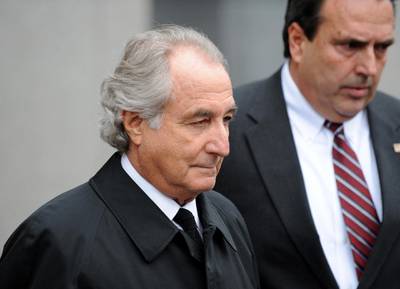 (FILES) In this file photo disgraced Wall Street financier Bernard Madoff leaves US Federal Court after a hearing on March 10, 2009 in New York. Madoff has agreed to plead guilty to 11 counts of fraud, his lawyer said in court.   Bernie Madoff, the mastermind behind the worst financial scam in history, has died in prison at age 82, US media reported on April 14, 2021. Madoff was sentenced to 150 years in prison in 2009 for running a pyramid-style scheme that defrauded tens of thousands of people around the world.The scheme was estimated to be worth anywhere between $25 billion and $63 billion. / AFP / STAN HONDA
