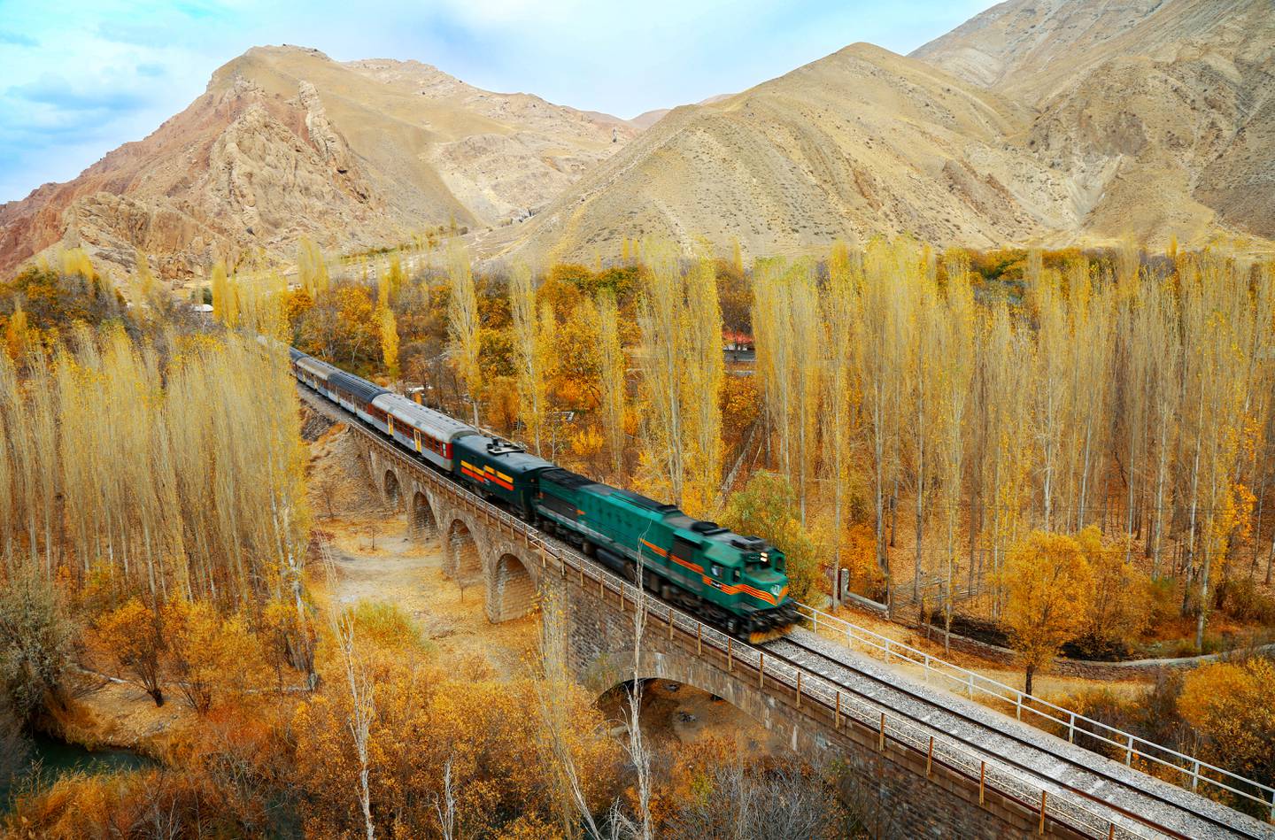 A commuter train on the North line, Zarrindasht-Mahabad route of the Trans-Iranian Railway. GM Locomotive