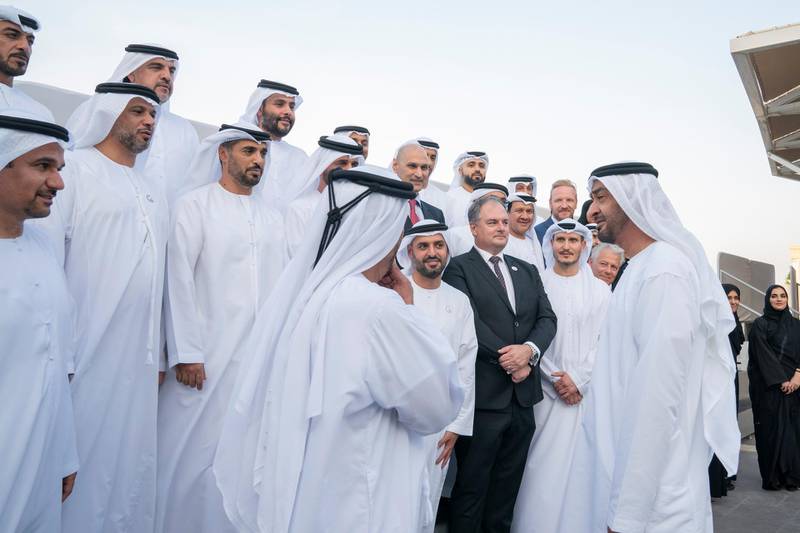 ABU DHABI, UNITED ARAB EMIRATES - September 09, 2019: HH Sheikh Mohamed bin Zayed Al Nahyan, Crown Prince of Abu Dhabi and Deputy Supreme Commander of the UAE Armed Forces (R), speaks with employees of the the Abu Dhabi Airport Company, during a Sea Palace barza.

( Mohamed Al Hammadi / Ministry of Presidential Affairs )
---