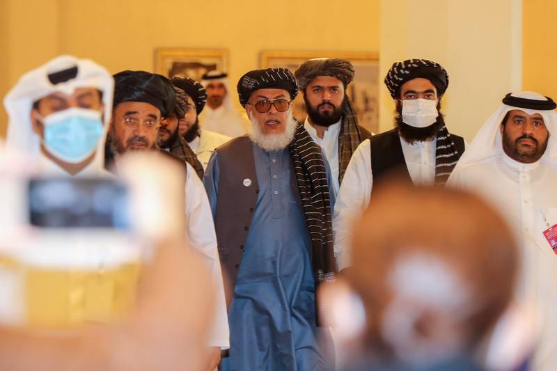 Taliban negotiator Abbas Stanikzai, centre, arrives for the opening session of the peace talks between the Afghan government and the Taliban. AFP