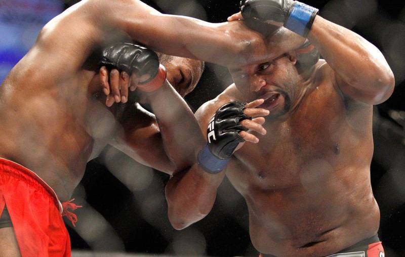 Jone Jones and Daniel Cormier grapple during their fight at UFC 182 on Saturday. Steve Marcus / Getty Images / AFP