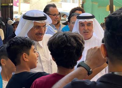 Islamic Development Bank Chairman Muhammad Al Jasser (left) and Emirati businessman Abdul Aziz Al Ghurair tour a refugee educational help centre in Amman. Khaled Yacoub Oweis / The National