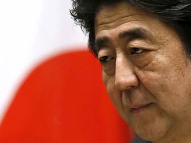 Shinzo Abe's legacy is a different Japan, braced for a more unstable world