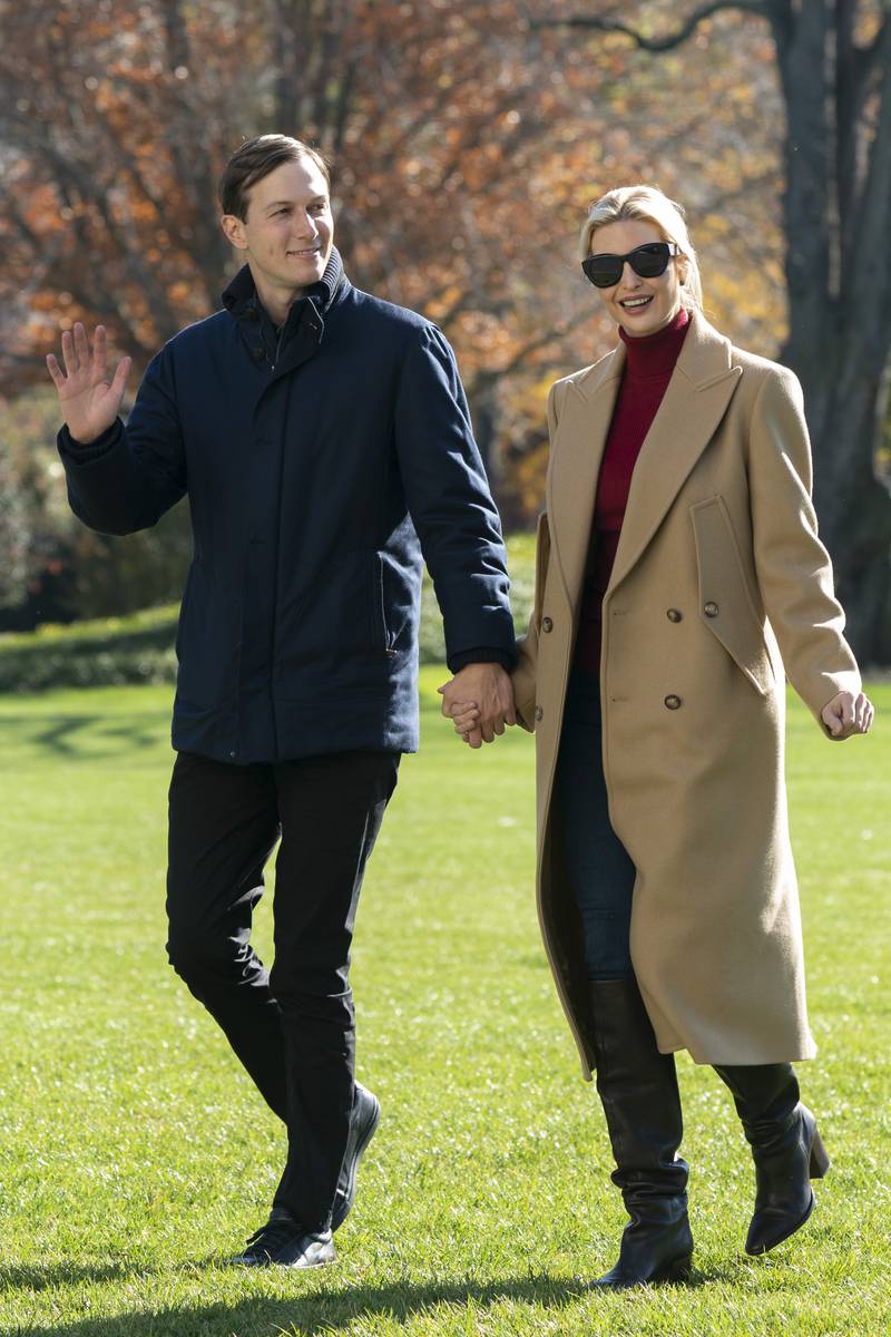 Ivanka Trump, wearing a camel coat and red polo neck, and Jared Kushner return to the White House on November 29, 2020. EPA 