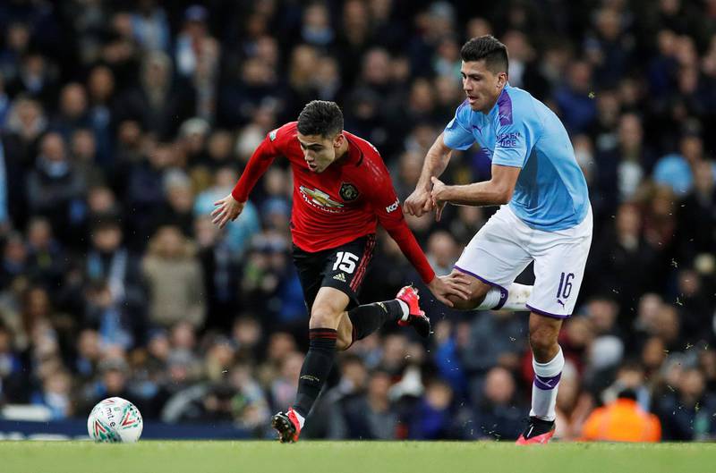 Manchester City's Rodri with Manchester United's Andreas Pereira. Reuters
