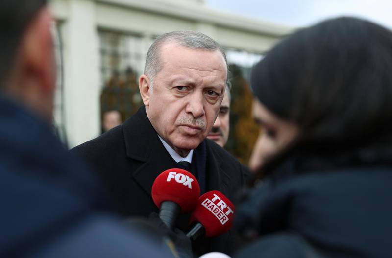 Turkish President Tayyip Erdogan talks to journalists in front of a mosque as he leaves friday prayers in Istanbul, Turkey, February 21, 2020. Murat Cetinmuhurdar/Presidential Press Office/Handout via REUTERS THIS IMAGE HAS BEEN SUPPLIED BY A THIRD PARTY. NO RESALES. NO ARCHIVES.