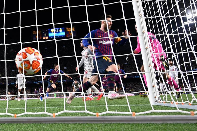 Lionel Messi celebrates after scoring. Lluis Gene / AFP