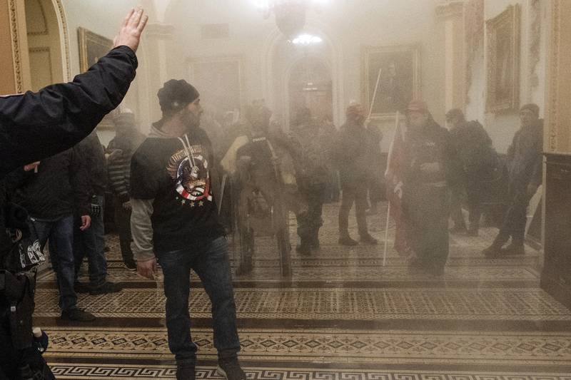 Smoke fills the hallway outside the Senate chamber of the Capitol. AP