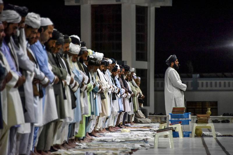 Muslims offer Taraweeh evening prayers on the first day of the Muslim holy month of Ramadan at a mosque in Kandahar city.  AFP