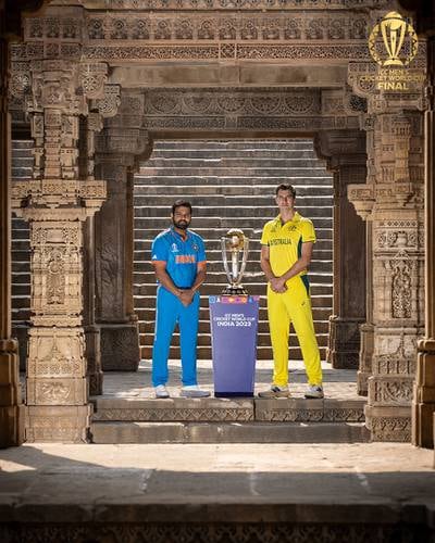 India captain Rohit Sharma, left, and Australia captain Pat Cummins pose with the World Cup trophy ahead of Sunday's final. Photo: @cricketworldcup / X formerly Twitter