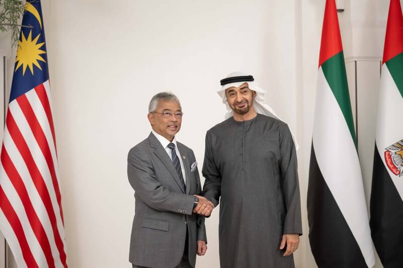 President Sheikh Mohamed greets Sultan Abdullah before the meeting