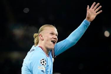 Manchester City's Erling Haaland shows five with his hand after he scored his 5th goal, the 6-0, during the Champions League round of 16 second leg soccer match between Manchester City and RB Leipzig at the Etihad stadium in Manchester, England, Tuesday, March 14, 2023.  (AP Photo / Dave Thompson)