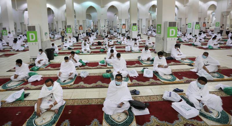 Muslim pilgrims pray on Arafat Day. . AP