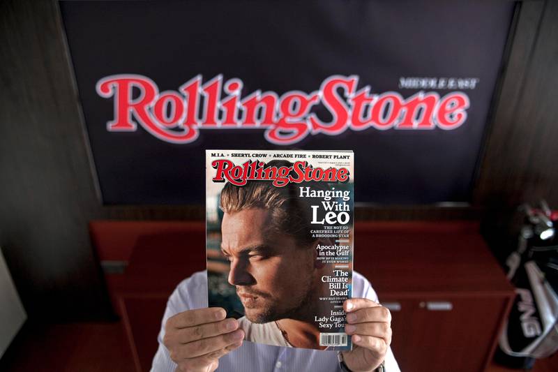 Dubai - September 7, 2010 - Hiding behind a recent edition of Rolling Stone magazine is Waref Hawasli the CEO/Managing Director of HGW Media in his office in Media City in Dubai, September 7, 2010. HGW will be publishing Rolling Stone Middle East beginning in November.(Photo by Jeff Topping/The National) 