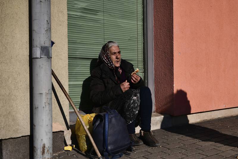 A refugee who fled conflict in Ukraine rests at a railway station after arriving in Zahony, Hungary. AP