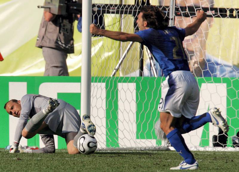 Italian midfielder Andrea Pirlo (R) runs past Australian goalkeeper Mark Schwarzer (L) to celebrate following a penalty kick scored by Italian midfielder Francesco Totti (not pictured) at the end of the round of 16 World Cup football match between Italy and Australia at Kaiserslautern's Fritz-Walter Stadium, 26 June 2006. Italy won the match 1-0 on the goal.            AFP PHOTO / ROBERTO SCHMIDT (Photo by ROBERTO SCHMIDT / AFP)