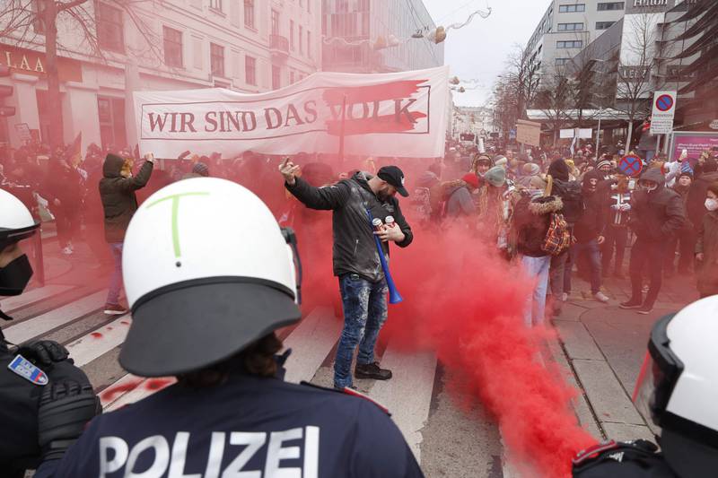 Police try to deter protesters during a demonstration against restrictive Covid-19 measures in Vienna, Austria. AFP