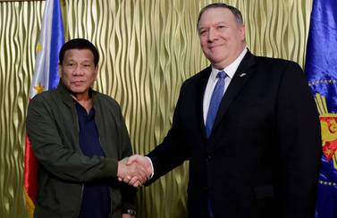 Philippine President Rodrigo Duterte greetingUS Secretary of State Mike Pompeo at Villamor Air Base south-east of Manila. AP
