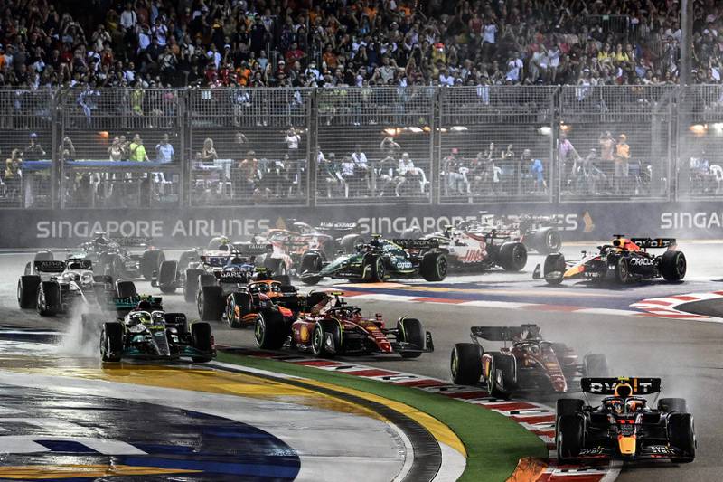 Red Bull Racing's Sergio Perez leads at the start of the  Singapore Grand Prix. AFP