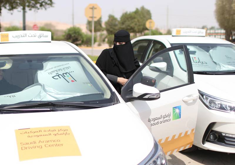 Learner Amira Abdelgader gets into a car for her driving lesson. Ahmed Jadallah / Reuters