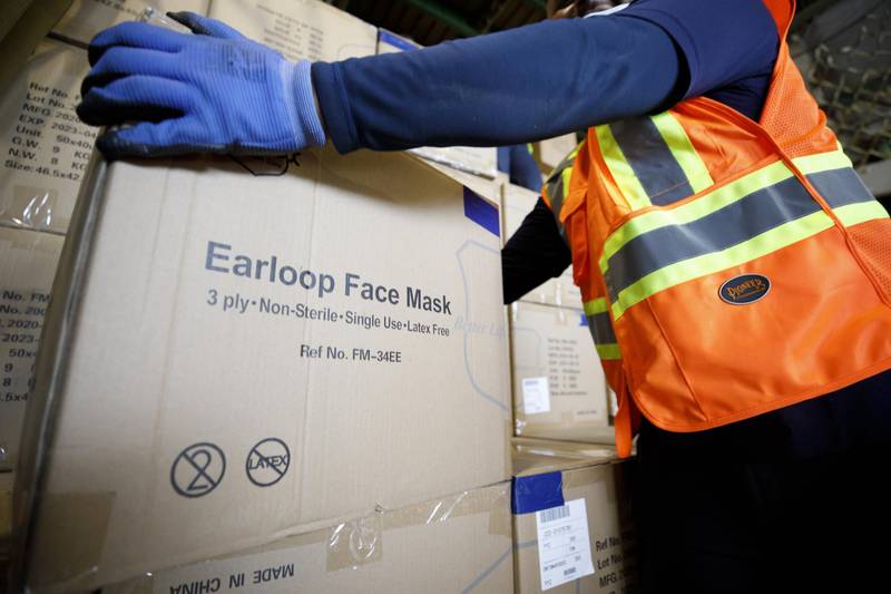 A worker unloads a shipment of medical supplies. Bloomberg