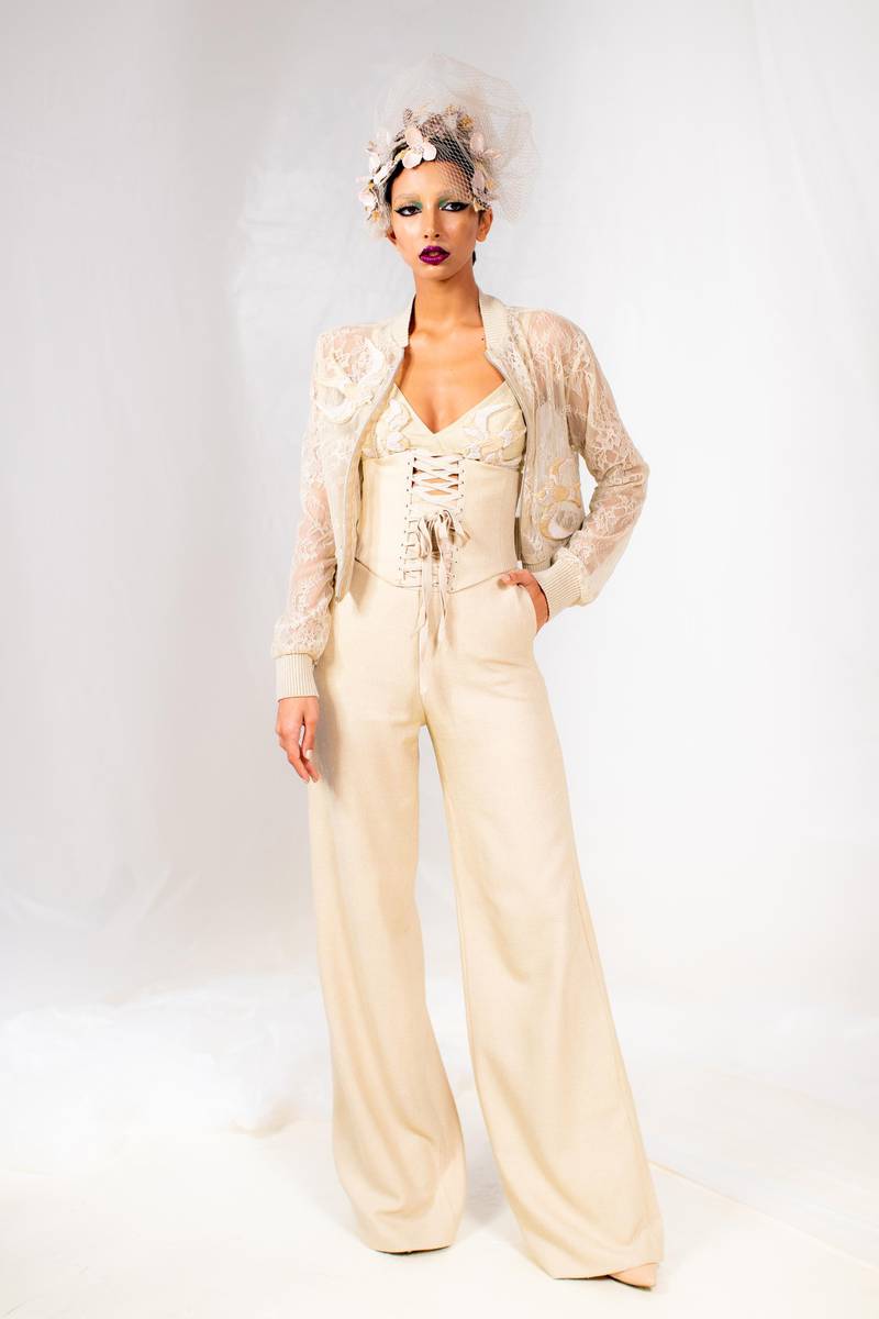 Amato closed Arab Fashion Week in style. One of the stand-out pieces was a directional trouser suit with wide cut trousers and laced corset-style bodice, topped with a lace bomber jacket. Courtesy AFW