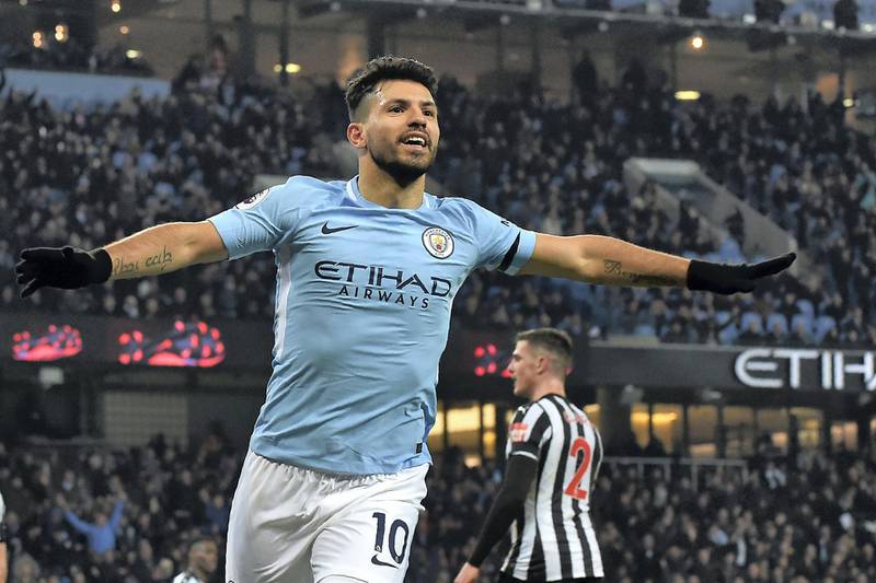 Manchester City's Argentinian striker Sergio Aguero celebrates after scoring the opening goal of the English Premier League football match between Manchester City and Newcastle United at the Etihad Stadium in Manchester, north west England, on January 20, 2018. / AFP PHOTO / PAUL ELLIS / RESTRICTED TO EDITORIAL USE. No use with unauthorized audio, video, data, fixture lists, club/league logos or 'live' services. Online in-match use limited to 75 images, no video emulation. No use in betting, games or single club/league/player publications.  / 