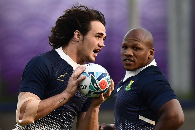 TOPSHOT - South Africa's lock Franco Mostert (L) and South Africa's hooker Bongi Mbonambi take part in a training session at Fuchu Asahi Football Park in Tokyo on October 23, 2019, ahead of their Japan 2019 Rugby World Cup semi-final against Wales. / AFP / Anne-Christine POUJOULAT
