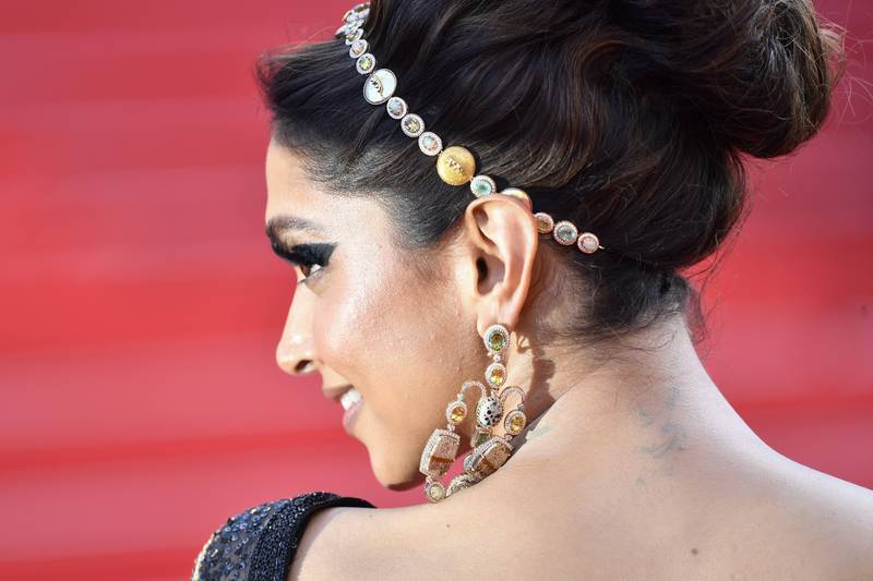 A close-up look at Padukone's headband and earrings. Getty Images 