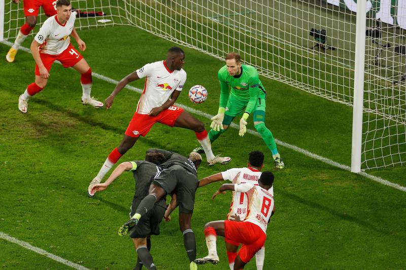 Manchester United midfielder Paul Pogba's header goes in off Leipzig's French defender Ibrahima Konate to make the score 3-2. AFP