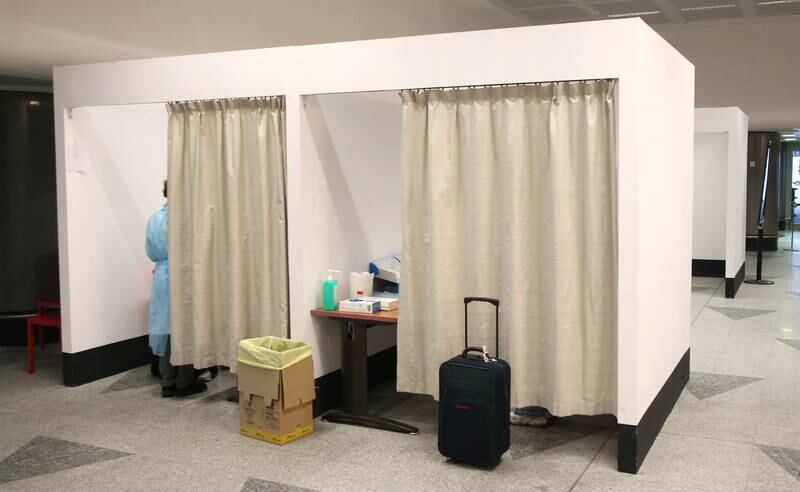 Travellers arriving from China are tested for Covid at Malpensa Airport, in Milan. EPA