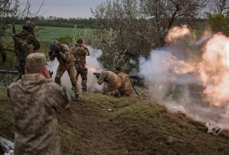 Ukrainian servicemen of the Territorial Defence Forces fire an anti-tank grenade launcher as they take part in a training exercise in Dnipropetrovsk. Reuters