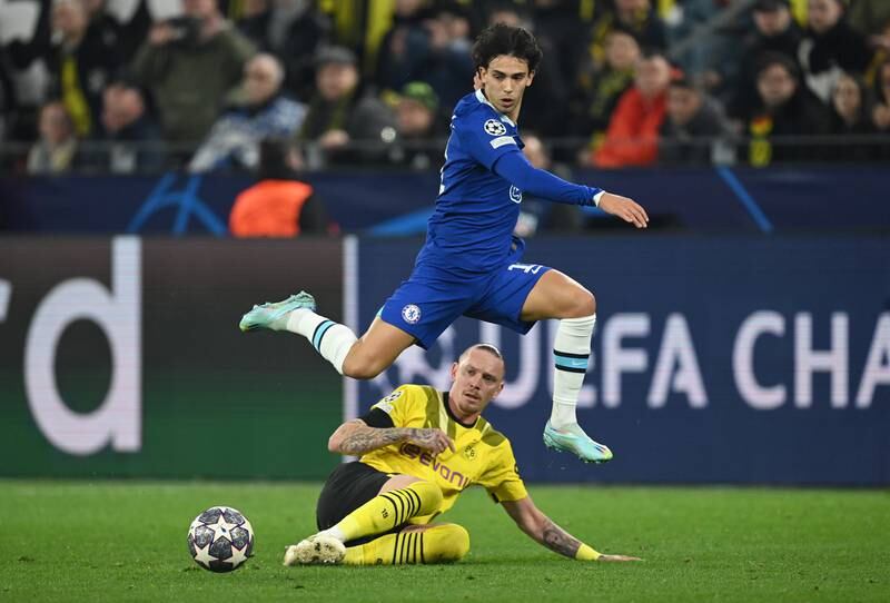 Chelsea's Joao Felix is challenged by Marius Wolf. Getty
