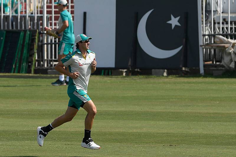 Australia's captain Pat Cummins warms up during a practice session at the Rawalpindi Cricket Stadium. AFP