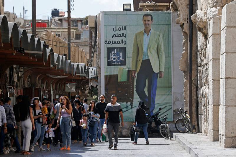 A poster of President Bashar Al Assad near the Grand Umayyad Mosque in Damascus.  AFP