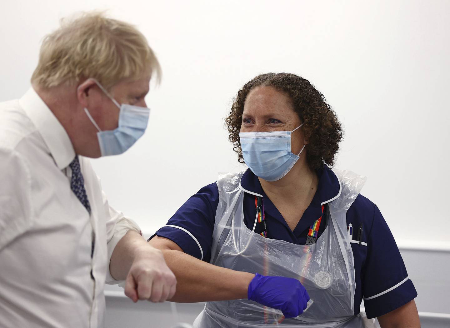 Britain's Prime Minister Boris Johnson greets a vaccination trainer during a hosptial visit as he faces further questions over his role in the Nusrat Ghani sacking. AP