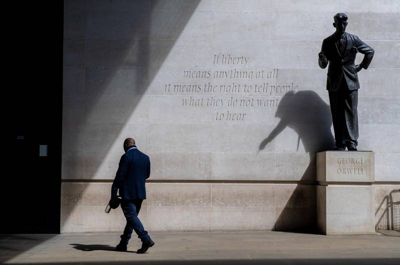A pedestrian passes a statue of George Orwell outside British Broadcasting Corp.'s (BBC) Broadcasting House in London, U.K., on Friday, May 28, 2021. The BBC has come under fire recently for its handling of an explosive interview with Princess Diana in the 1990s, which journalist Martin Bashir was found to have secured through forgery. Photographer: Chris J. Ratcliffe/Bloomberg