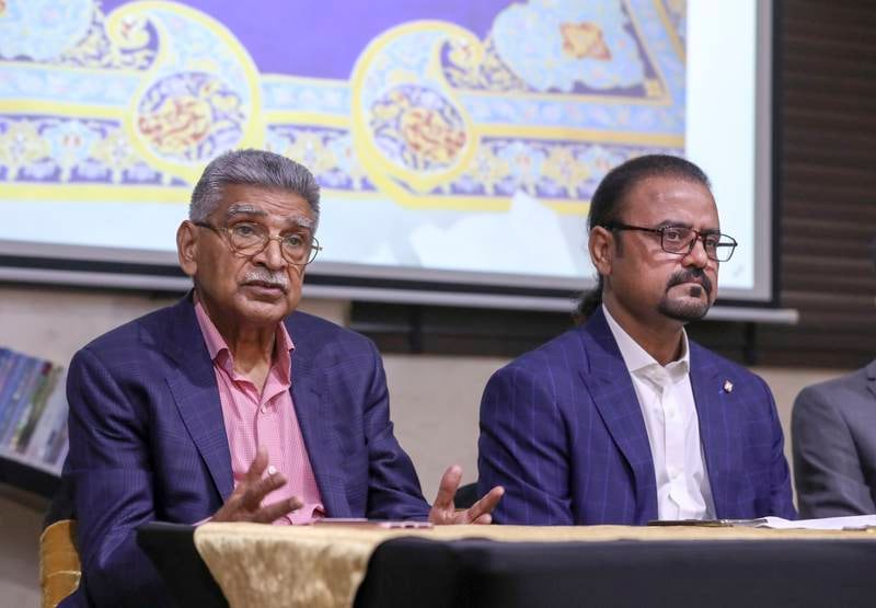 Irfan Mustafa, left, a Dubai-based entrepreneur and Shahid Rassam's benefactor, speaks at the press conference for the Quran project at the Niaz Muslim Library in Dubai. Khushnum Bhandari / The National