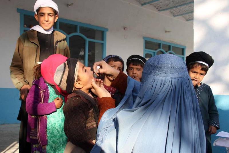 An Afghan health worker administers a polio vaccine in Kandahar. Afghanistan and Pakistan are the only two countries where polio remains endemic, crippling hundreds of children every year. Muhammed Sadiq / EPA