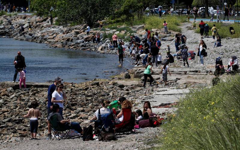 Children enjoy a sunny day with their parents, after being allowed to go out for four hours for the first time since April 4 in Istanbul, Turkey. Reuters