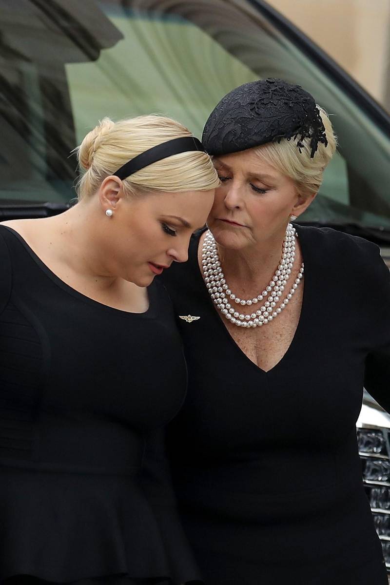 Meghan McCain and her mother Cindy McCain embrace as the casket of the late Senator John McCain arrives at the Washington National Cathedral for the funeral service. Getty Images / AFP