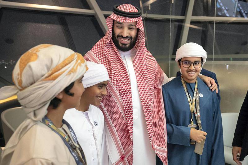 YAS ISLAND, ABU DHABI, UNITED ARAB EMIRATES - November 25, 2018: HRH Prince Mohamed bin Salman bin Abdulaziz, Crown Prince, Deputy Prime Minister and Minister of Defence of Saudi Arabia (3rd L), stands for a photograph with HH Sheikh Zayed bin Abdullah bin Zayed Al Nahyan (L), HH Sheikh Zayed bin Nahyan bin Zayed Al Nahyan (2nd L), and HH Sheikh Mohamed bin Abdullah bin Zayed Al Nahyan (4th L), at Shams Tower during the Formula 1 2018 Etihad Airways Abu Dhabi Grand Prix at Yas Marina Circuit. 
( Ryan Carter / Ministry of Presidential Affairs )
---