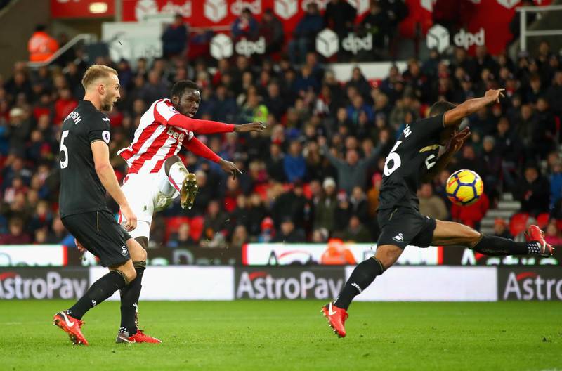 STOKE ON TRENT, ENGLAND - DECEMBER 02: Mame Biram Diouf of Stoke City scores his sides second goal during the Premier League match between Stoke City and Swansea City at Bet365 Stadium on December 2, 2017 in Stoke on Trent, England.  (Photo by Clive Brunskill/Getty Images)