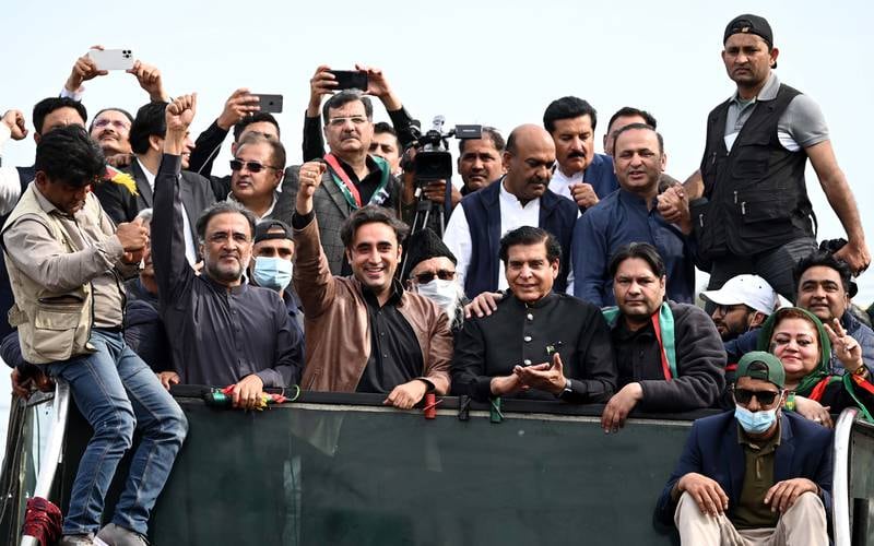Mr Bhutto Zardari waves to supporters during an anti-government 'long march' from Karachi to Islamabad, on March 7. EPA
