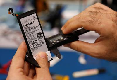 A Samsung Note 7 battery is measured for its physical dimensions at the laboratory in Singapore. Edgar Su / Reuters
